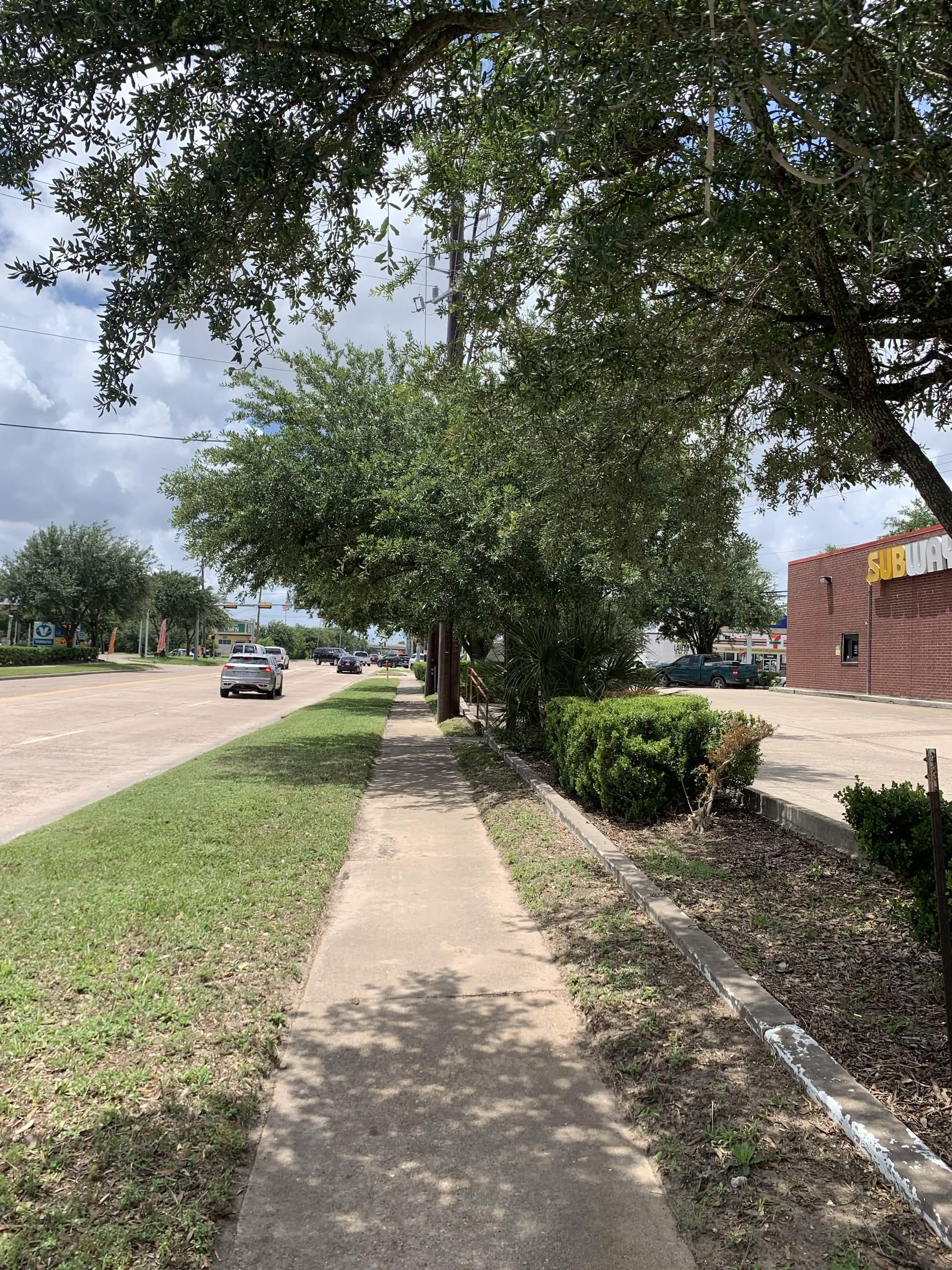 Trimmed sidewalk edge and cleaned landscape area after service